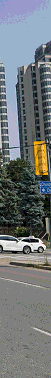 A low resolution, blurred, Toronto Streetscape, on Yonge Street, near the DCKIM sign.